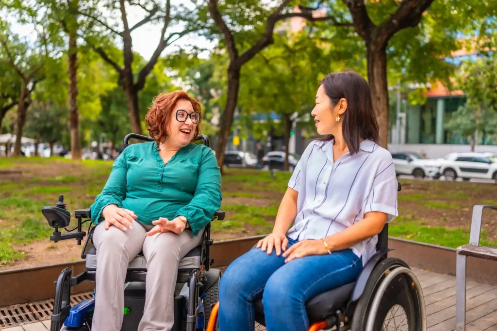 Two disabled friends in wheelchair